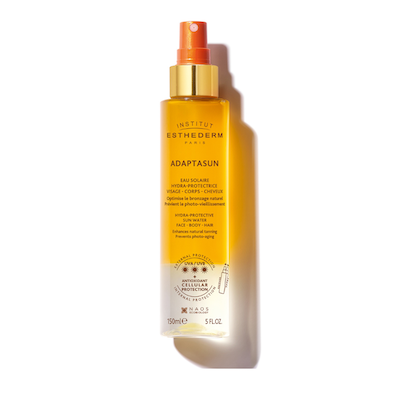 Envase de Adaptasun Agua Solar Fotoprotectora de Institut Esthederm, spray hidratante para rostro, cuerpo y cabello.